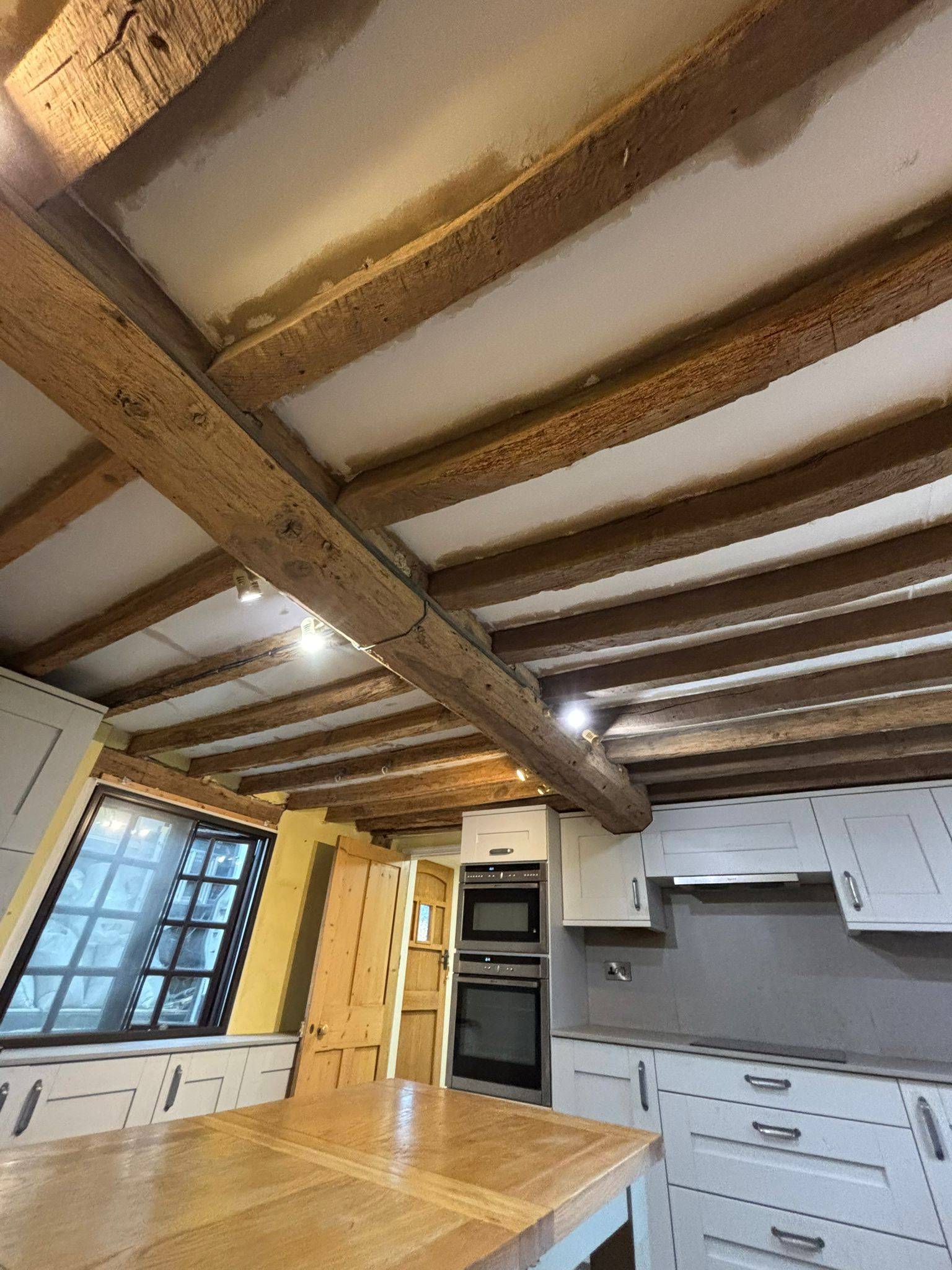 Exposed oak beams following restoration