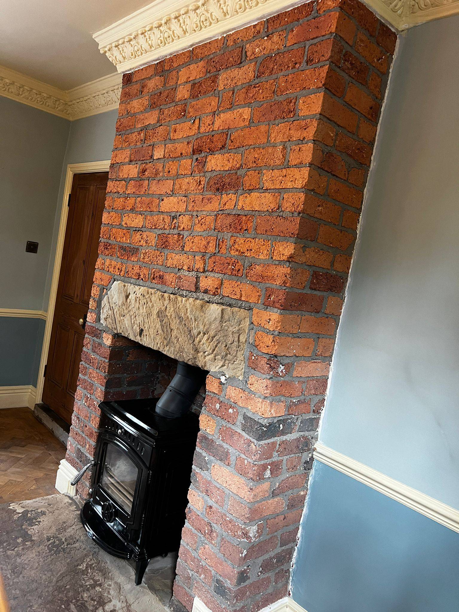 Brick fireplace after coating removal