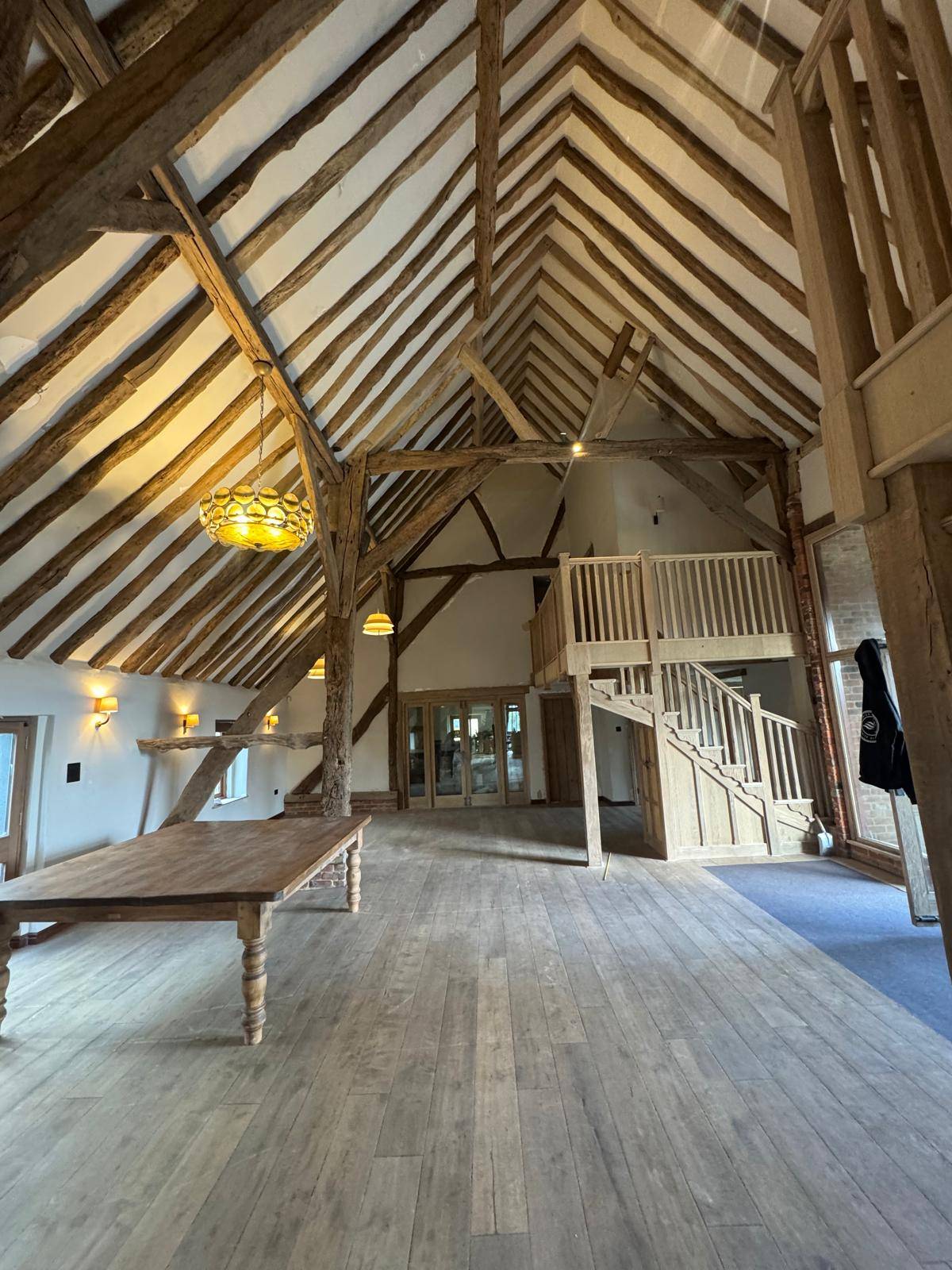 Grand barn with exposed lighter timbers after cleaning