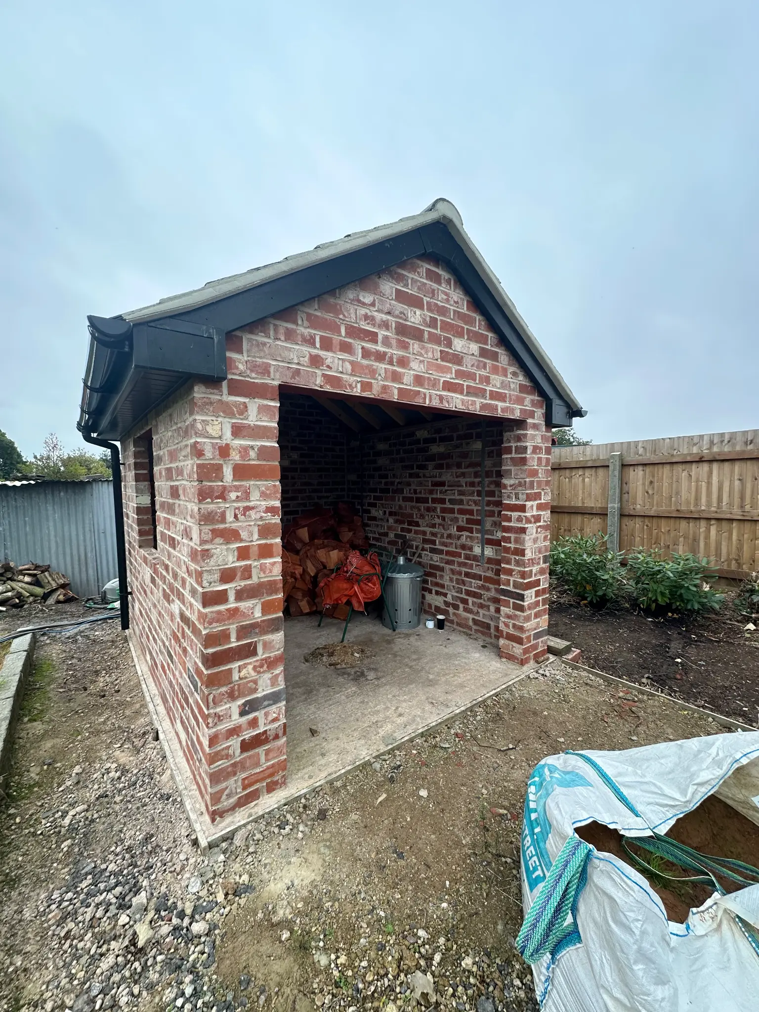 Brick garden outbuilding entrance before surface cleaning