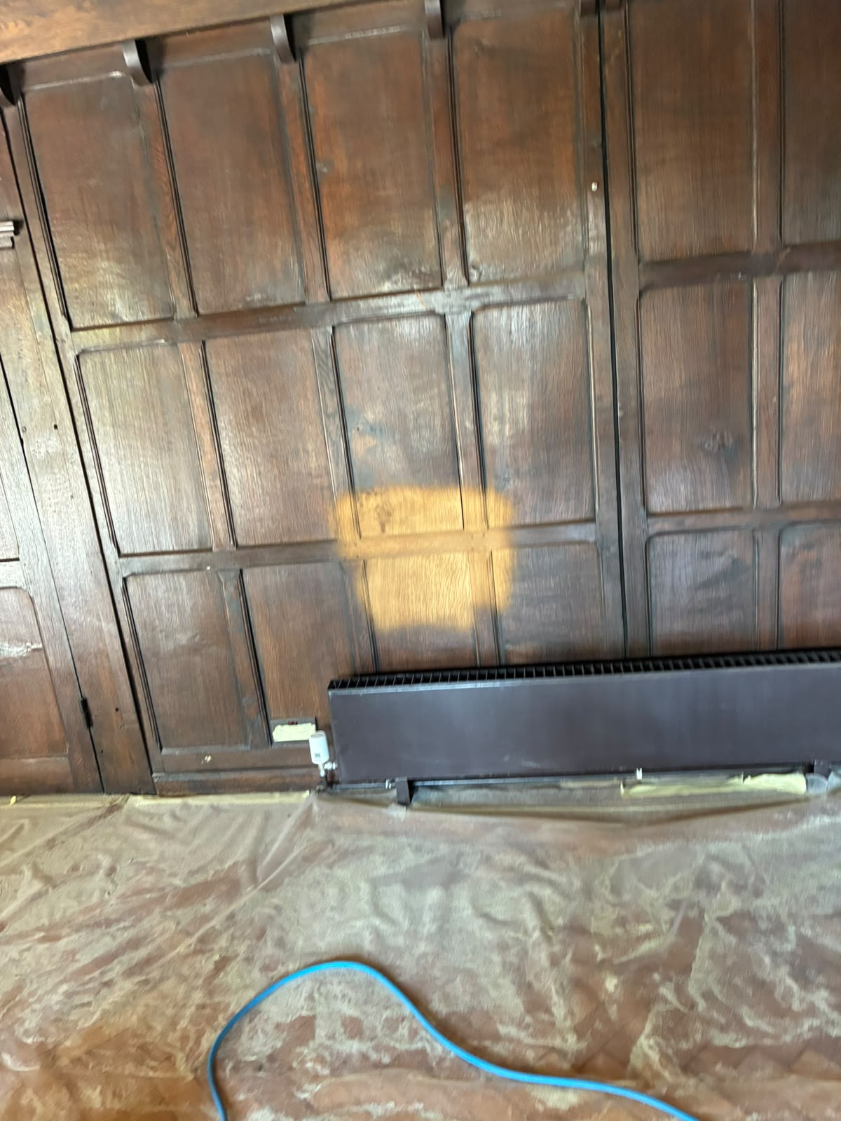 Grand Hall lower landing timber panelling before restoration