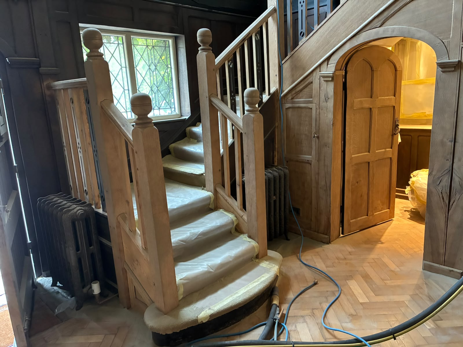 Grand Hall staircase and timber panelling during the documented project