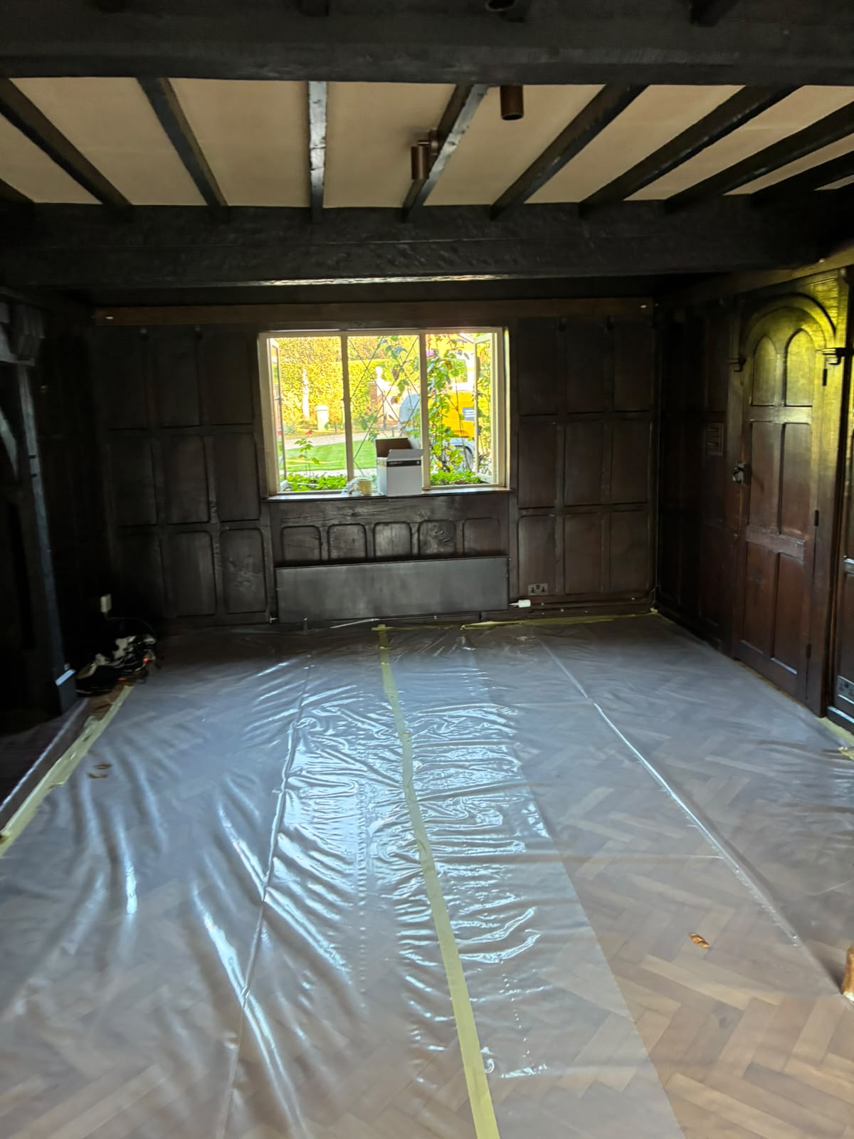 Grand Hall fireplace end of living area before timber restoration