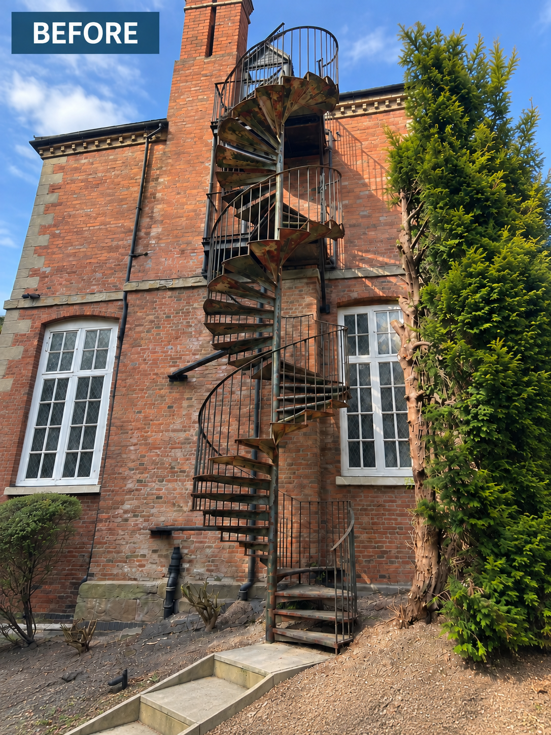 External spiral staircase at Bromsgrove School before the published restoration